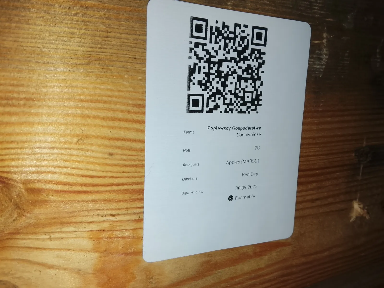 QR code harvest label printed from Farmable showing farm, plot, variety and harvest date