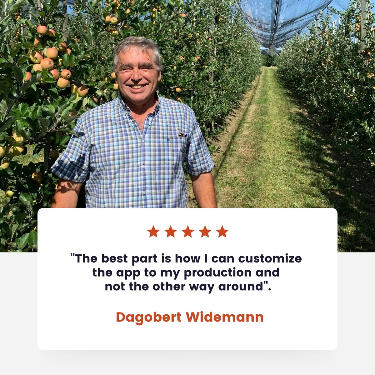 Dagobert Widemann holding freshly picked apples in his orchard at Obsthof Ainser-Widemann near Lake Constance