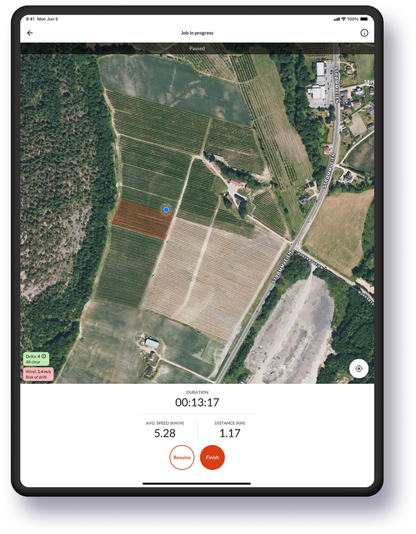 Farmable job-in-progress screen on an iPad with live GPS tracking of a vineyard spray